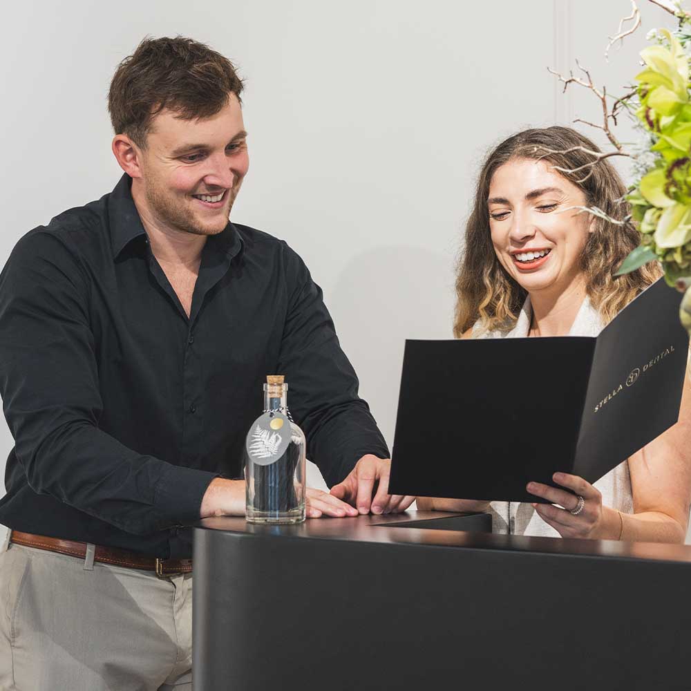 two people at the reception of stella dental suite