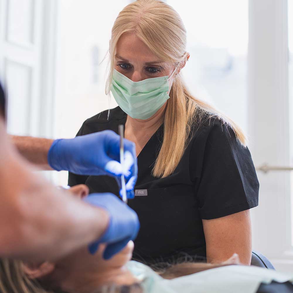 Woman receiving dental treatment at stella dental suite