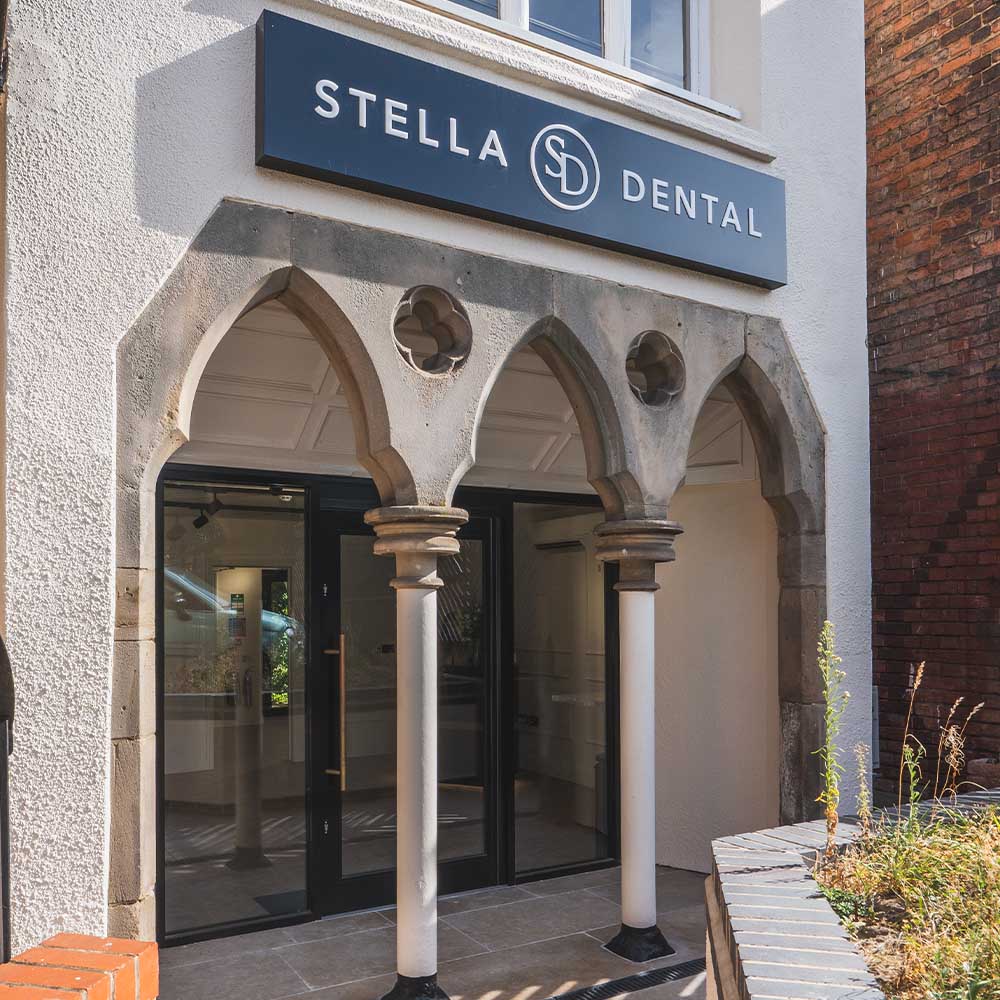 Stella Dental building entrance with sign above the door