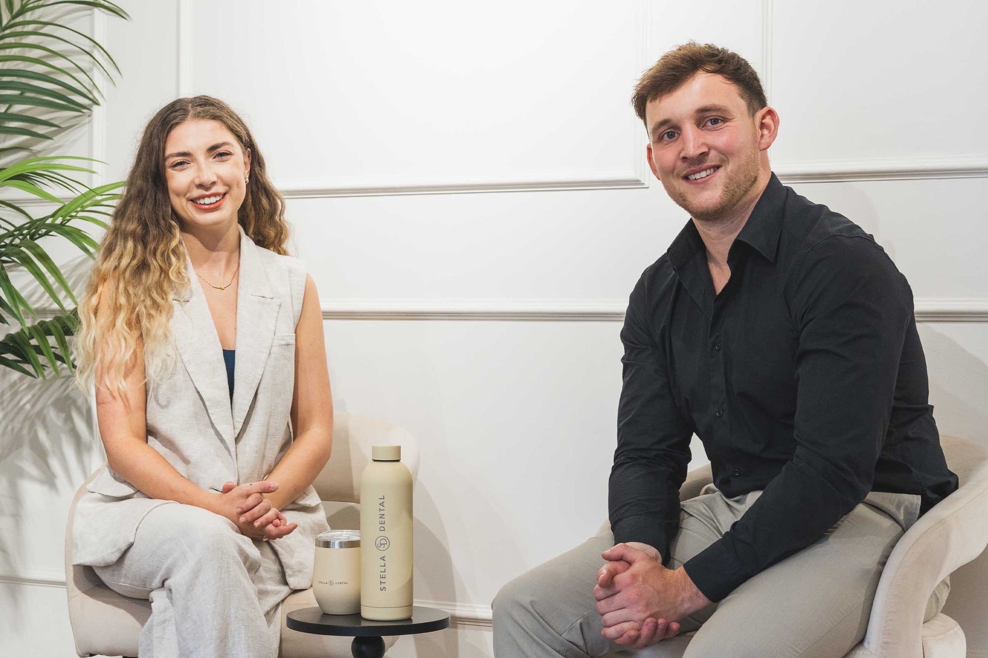 Two people sitting together in a modern indoor setting 
