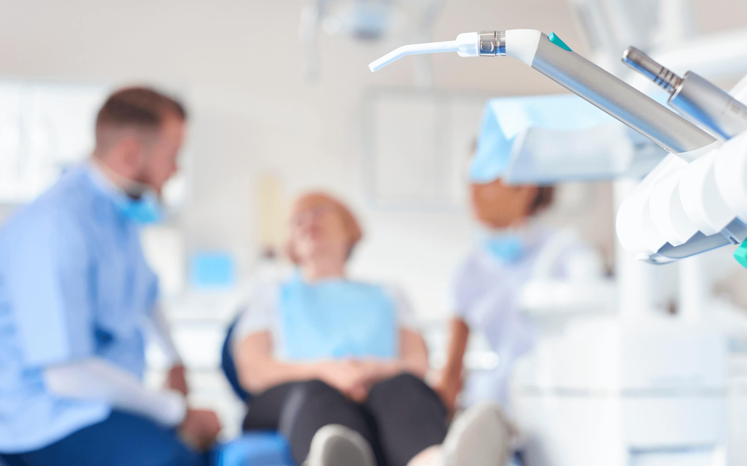 A woman sat in a dental chair having a consultation with one of our dentists here at Stella Dental, Stafford.