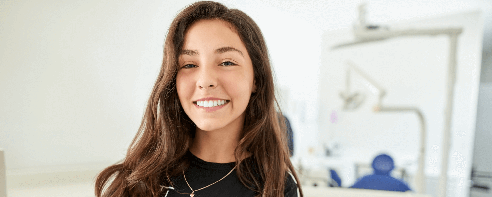 Girl smiling with dental implants